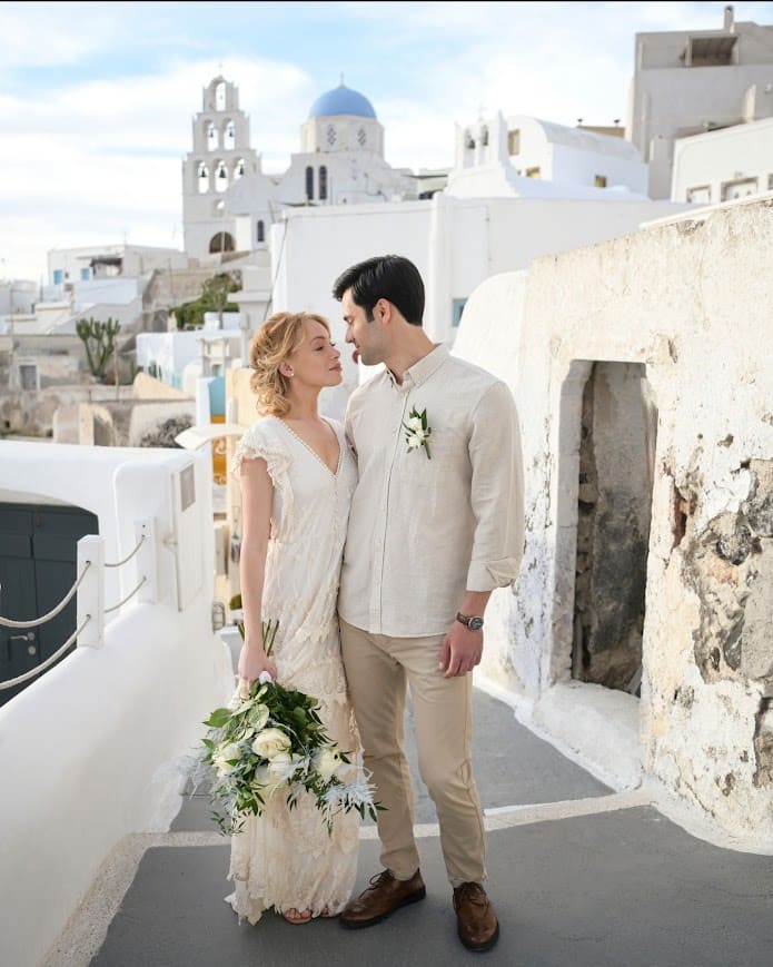 Wedding couple in Pyrgos village streets Santorini