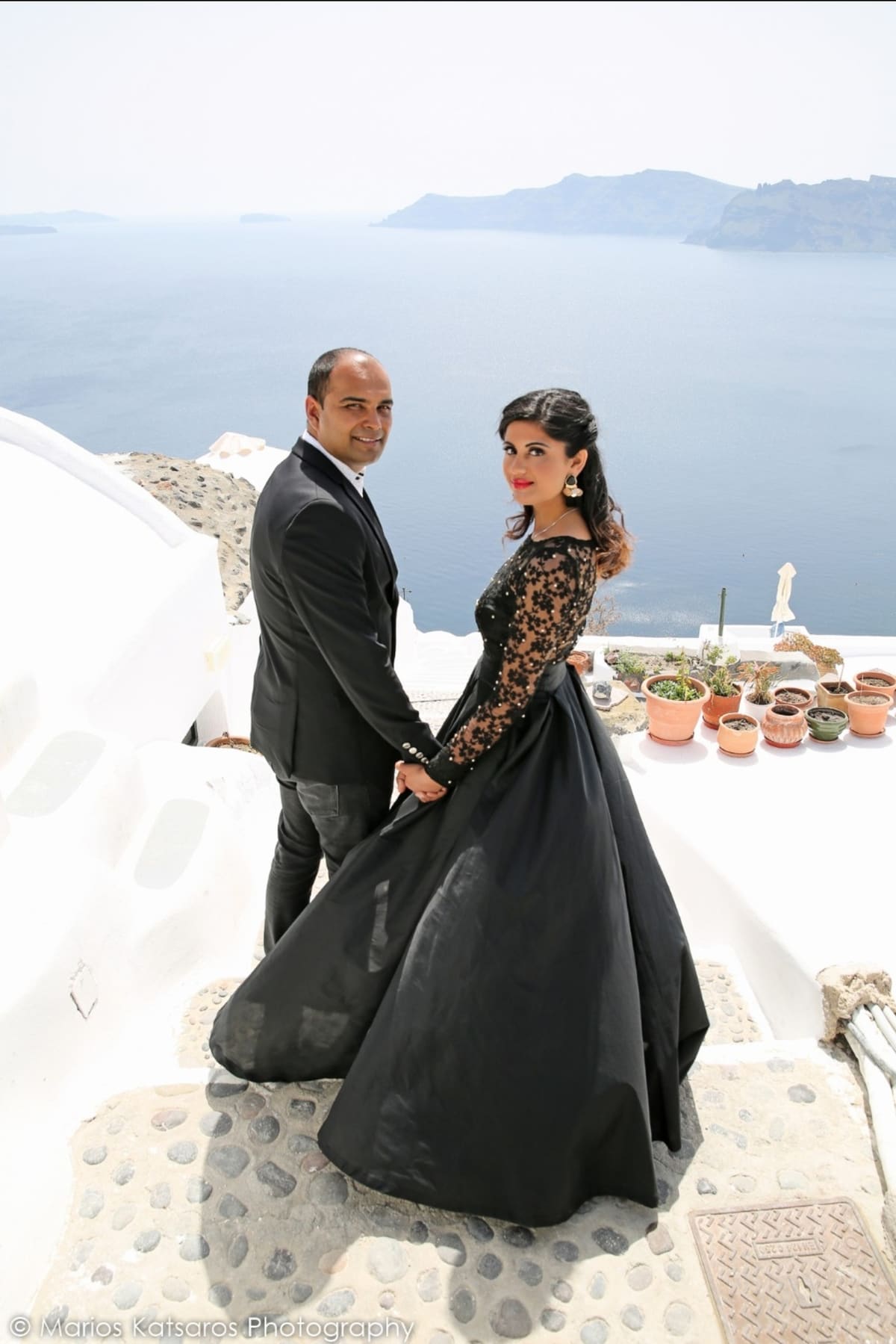 Indian wedding couple at Santorini caldera