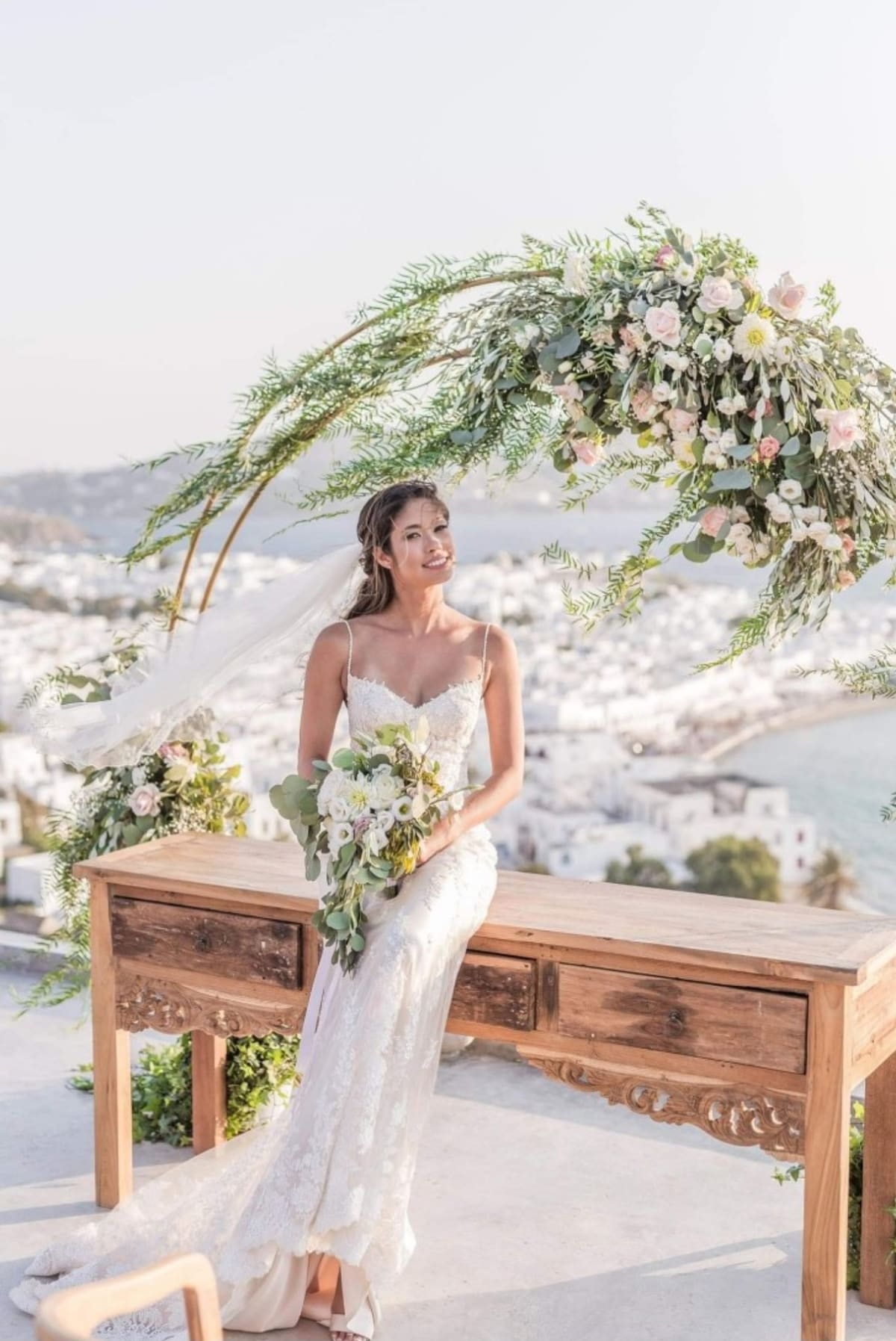 Luxury bride with floral arch in Mykonos